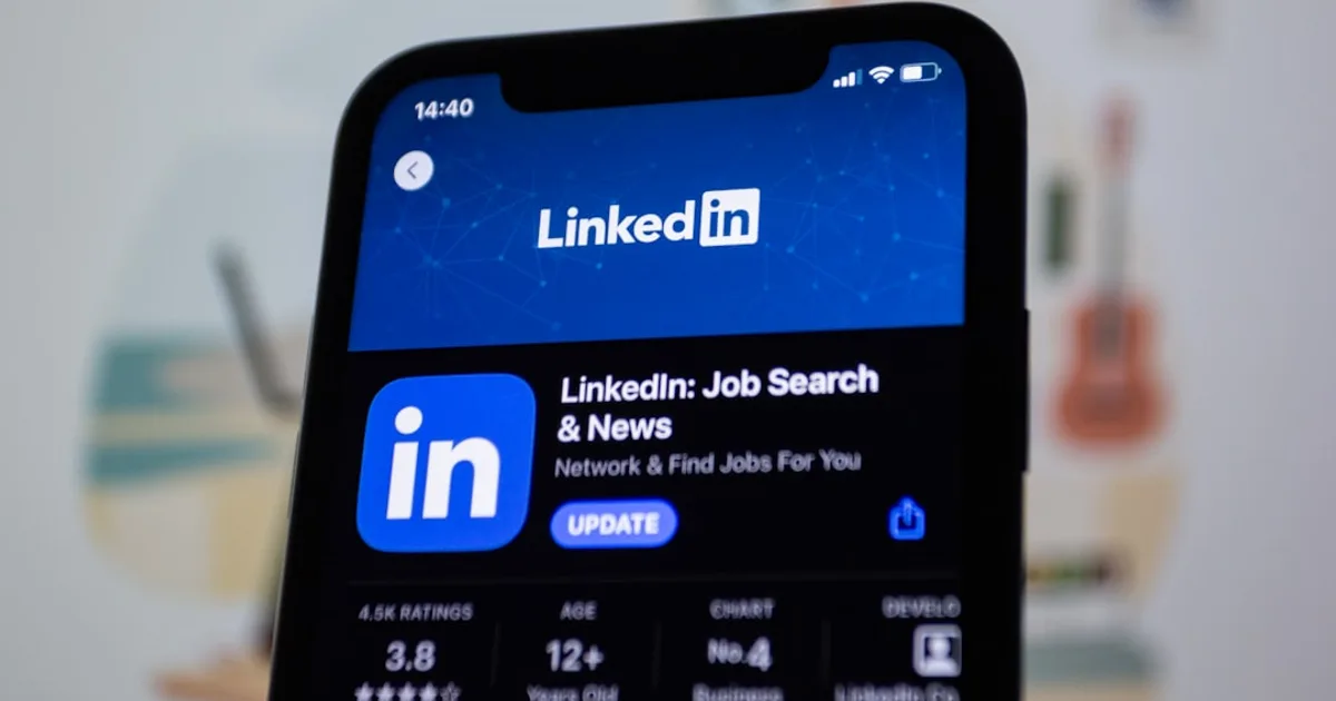 the linkedin logo is displayed on a smartphone